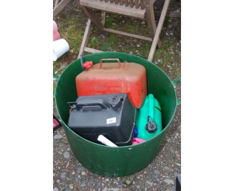 A plastic trug and fuel cans.