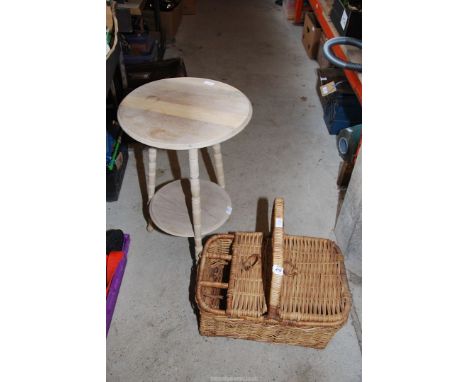 A wicker hamper basket and pot stand.
