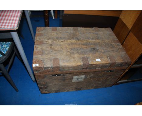 A pine metal bound trunk, 33" wide x 20" deep x 20" high.