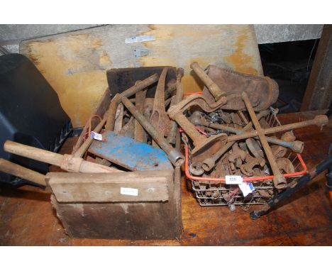 A large quantity of old spanner wheel braces, old handles, plough parts, etc.