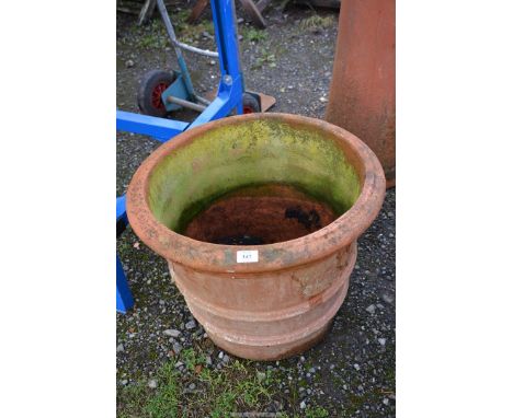A large terracotta planter,  21" depth x 17 1/2" high.