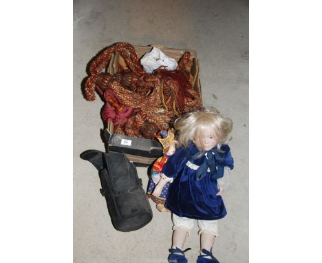 Curtain tie backs and costume dolls.