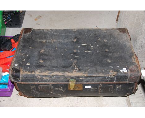 A black trunk with leather fittings approx. 1900, well used condition.
