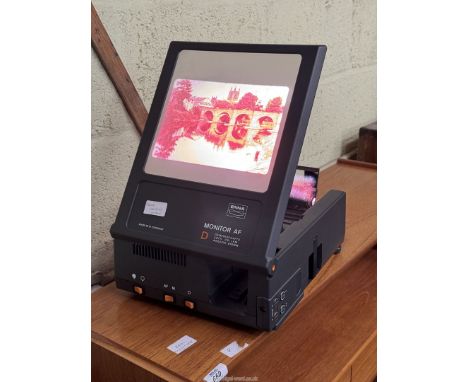 A boxed West German made "Enna" Dual Purpose auto focus 35 mm Slide Projector with built-in Monitor Screen and wired remote c