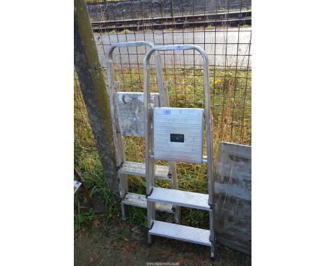 Two aluminium step ladders.