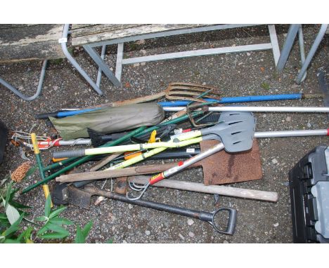 A quantity of garden tools and a folding chair, etc.