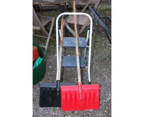 A two rung step stool and a snow shovel.