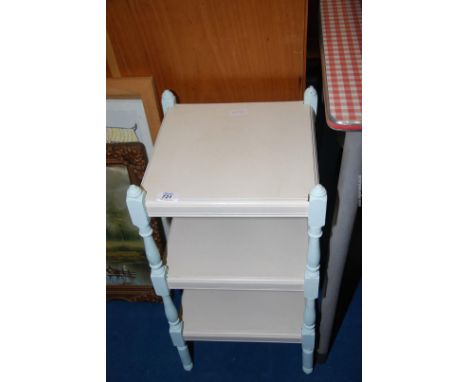 A painted three tier shelf.