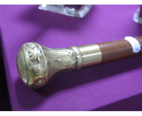 A Contemporary Huntsman's Walking Stick with brass screw top revealing a clear glass tube with stopper.