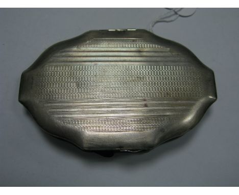 A Hallmarked Silver Ladies Compact, RD&amp;Co, Birmingham 1944, of shaped design engine turned.
