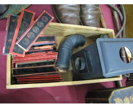 A Tinplate Magic Lantern Projector, stamped 'J.F Made in Germany', together with a quantity of nursery rhyme slides.