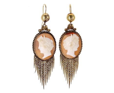Attractive pair of antique cameo drop earrings, each with carved shell portrait profiles in yellow metal oval mounts over tas