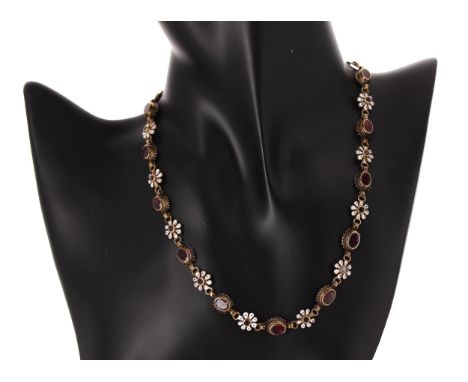 Attractive antique gold backed garnet and enamel necklace, with fourteen oval rub-over set garnets between garnet and enamel 