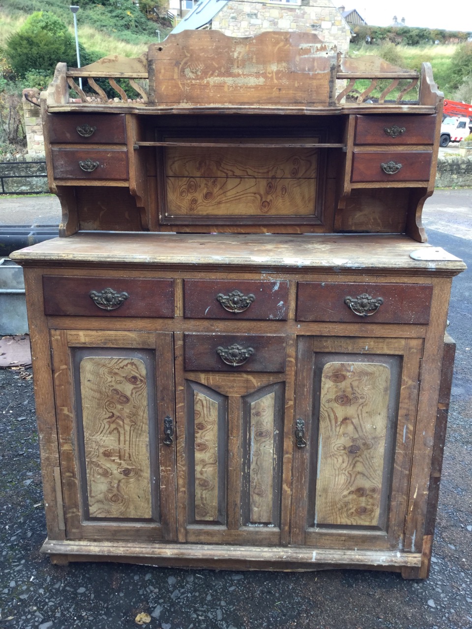 A Victorian scumbled pine Scotch dresser, the superstructure with