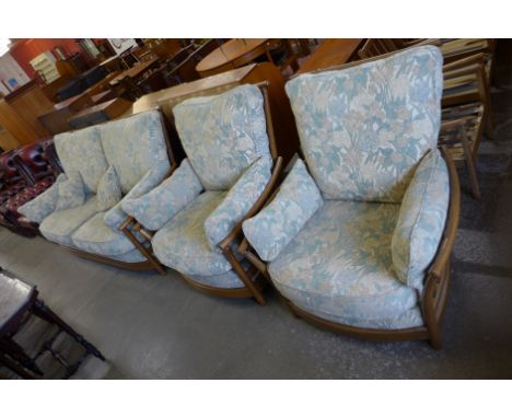 An Ercol Golden Dawn elm and beech Renaissance settee and two armchairs 