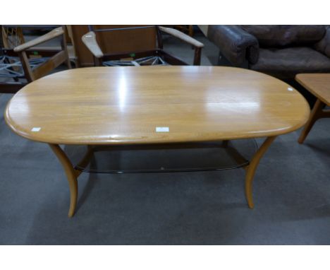 An Ercol ash and smoked glass coffee table 