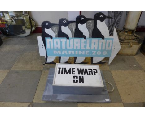 A painted Natureland marine Zoo sign and a Time Warp light box 