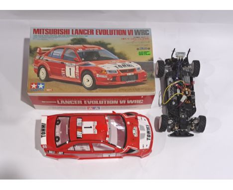 Tamiya Mitsubishi Lancer Evolution VI WRC Racing Car 1:10 scale Radio Control Model Kit part built, boxed. Although untested 