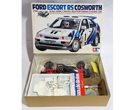 Tamiya Ford Escort RS Cosworth Racing Car 1:10 scale Radio Control Model Kit, part built, boxed. Although untested &amp; unch
