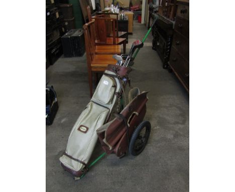 A vintage Slazenger golf bag, trolley and George Nicoll Zenith and other clubs
