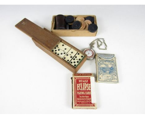 A vintage Monaco Roulette pocket game, two sets of late 19th Century American playing cards, draughts pieces and dominoes 