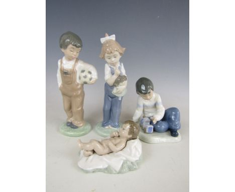 Four Nao figures including Boy with train and Boy with football 