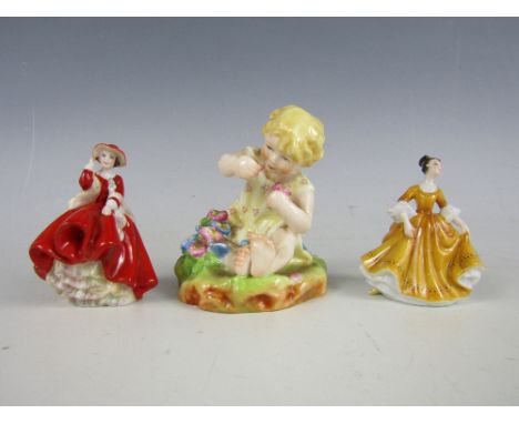 A Royal Worcester figurine Mischief together with two small Royal Doulton figurines 