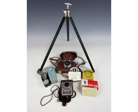 A Halina camera together with a tripod etc