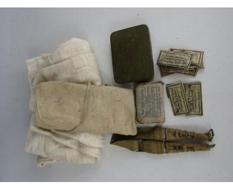 A small group of Second World War British Army kit including a ration tin, long Johns and a washing kit roll