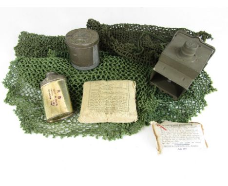 A quantity of WWII British Army small kit including helmet nets and an electric lamp
