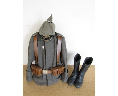 A mannequin display of reproduction Imperial German Infantry clothing and accoutrements including a pickelhaube and marching 