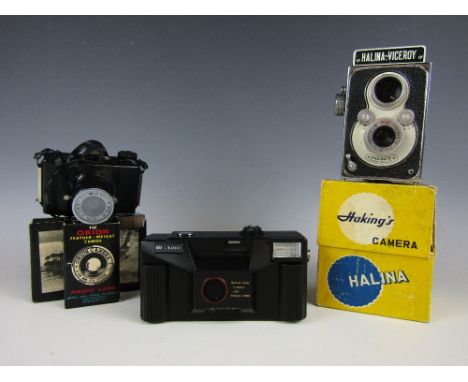 A boxed Hakings camera together with an Orion camera and one other