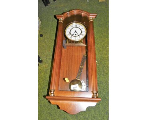 An oak cased Vienna wall clock, stamped Widdop. 