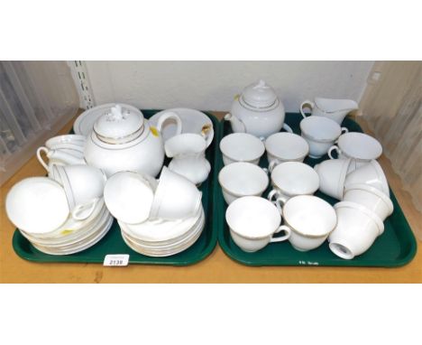 A Royal Worcester Contessa pattern part tea service, with two teapots (AF), teacups, saucers, side plates, milk jugs and suga
