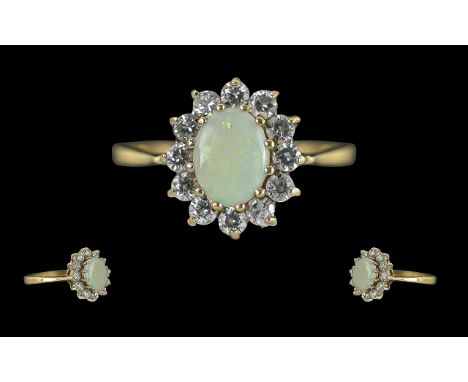 Ladies - Attractive 9ct Gold Diamond and Opal Set Cluster Ring, Flower head Setting, The Central Oval Shaped Opal of Good Col