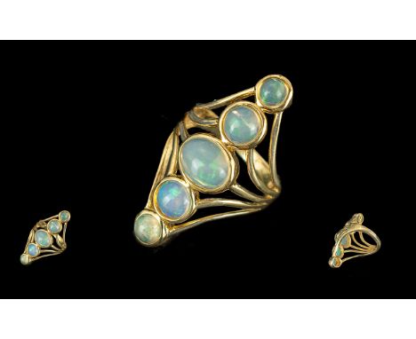 Opal Five Stone Elongated Statement Ring, five jelly opals, the largest, at the centre being an oval cut cabochon of 1.5cts, 