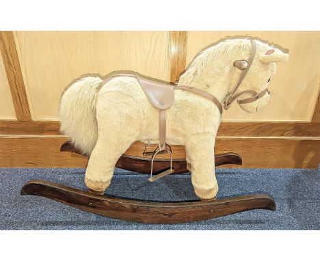 Child's Rocking Horse, raised on wooden rockers, cream fur, for the younger child, measures 24" high x 33" wide.  Neighs when