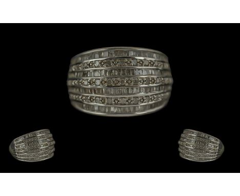 9ct Gold Diamond & Baguette Seven Row Ring, weight 4.50, ring size N.
