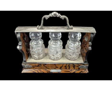 Mappin & Webb Miniature Tantalus, silver plated and oak frame, with three hobnail cut small decanters.  Measures 8" high x 9"