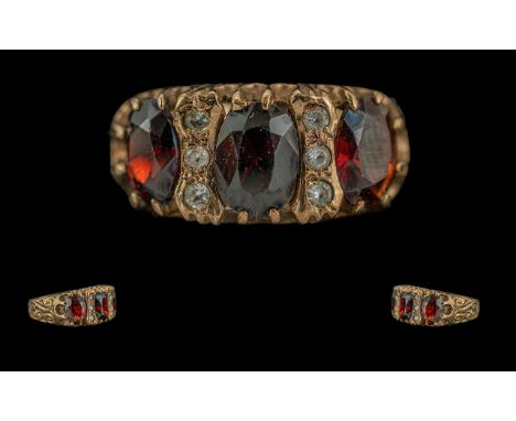 Ladies 9ct Gold Garnet and Diamond Set Ring, Full Hallmark to Interior of Shank, The Large Faceted Garnet Set with Diamond Sp