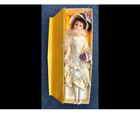 Large Modern China Faced Doll, dressed in a silk dess with hat and bag.  Approx 27'' tall, boxed.