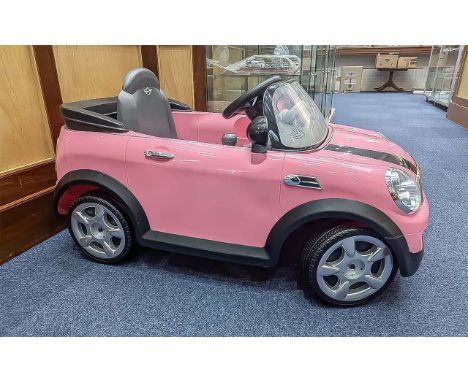 Child's Rechargeable Battery Pink Mini Cooper, Barbie pink with black stripes and black interior, wing mirrors, one plastic c