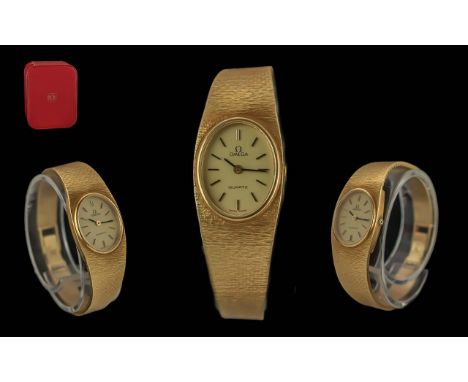 Omega Ladies 18ct Gold Quartz Wrist Watch with Integral Bracelet. Marked 750 - 18ct. Hallmark for 1970's. Weight 41.9 grams. 