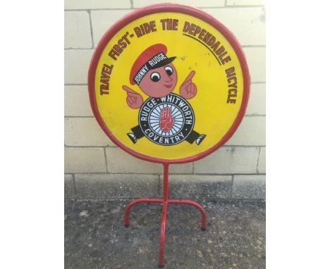 A Rudge - Whitworth of Coventry circular double sided freestanding enamel sign depicting the advertising figure Johnny Rudge,