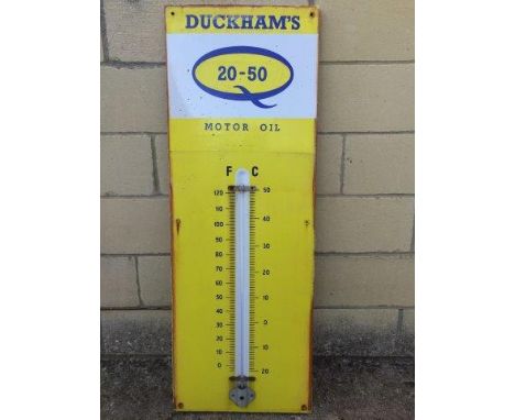 A Duckham's 20-50 Motor Oil yellow enamel thermometer, 13 x 36".