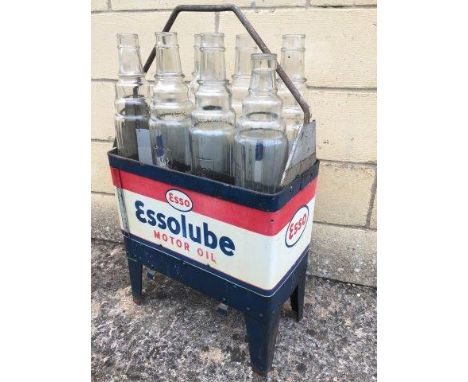 An Essolube Motor Oil eight bottle crate with wrap-around advertising and eight Esso bottles.