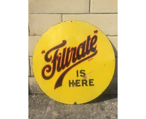 A Filtrate is Here circular enamel sign, 23 3/4" diameter.