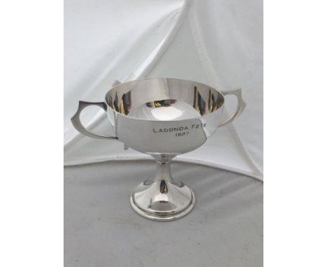 A silver two handled cup engraved 'Lagonda Fete 1927', Sheffield 1927.