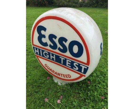 An Esso Hi-Test Guaranteed glass petrol pump globe with re-touched lettering.