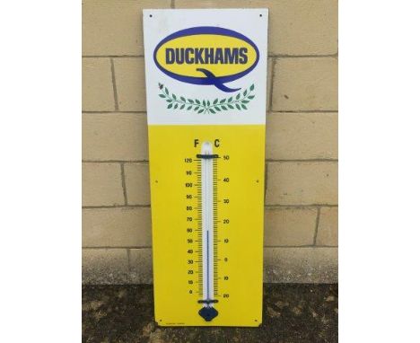 A Duckhams blue, yellow and white enamel thermometer by Burnham of London, in excellent condition, 13 x 36".